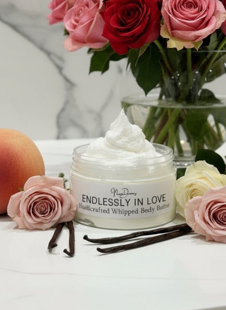 Jar of 'Endlessly in Love' whipped body butter against an elegant background of red roses. Remove lid.